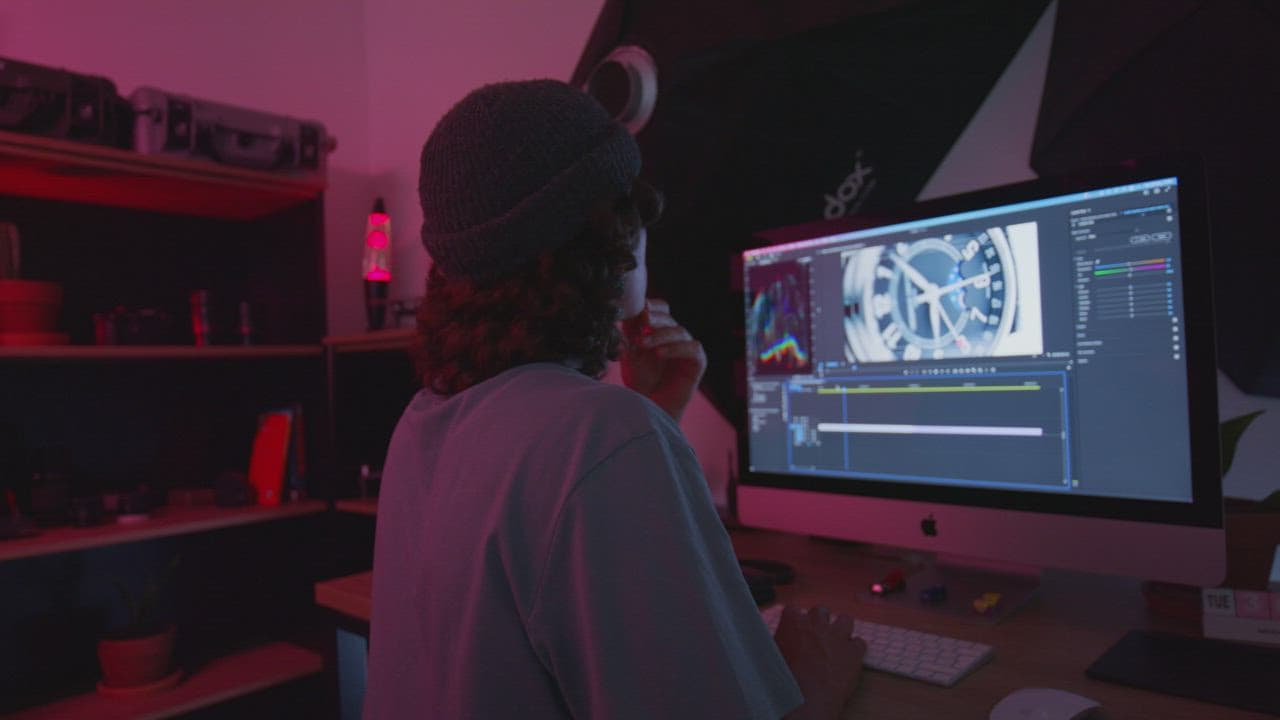 Editor reviewing and cutting footage on a computer workstation